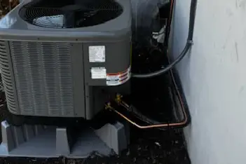 Professional HVAC technician working on air conditioning system