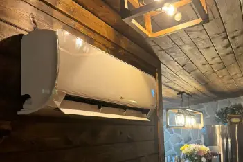 Professional HVAC technician working on air conditioning unit in Covington