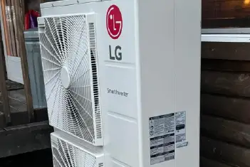 Professional HVAC technician working on heating and cooling system